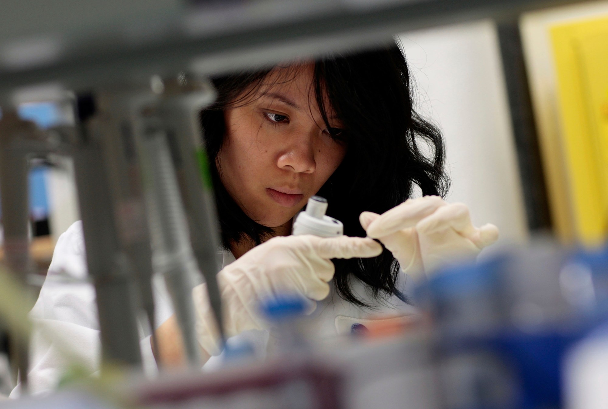 Hanh Nguyen, an intern with the Immunogen Design Group, works at the AIDS Vaccine Design and Development Laboratory in New York City. (Chris Hondros)
