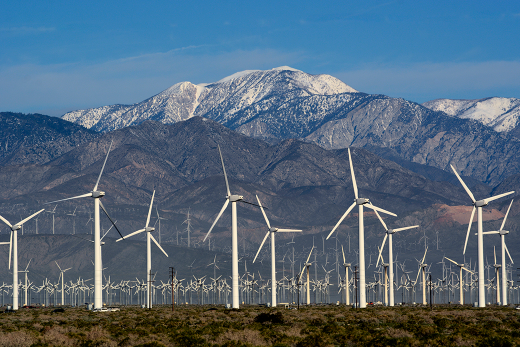 Wind turbines generate electricity near Palm Springs, California, with snow-covered Mt. San Jacinto in the background, February 2019. (Getty/Robert Alexander)