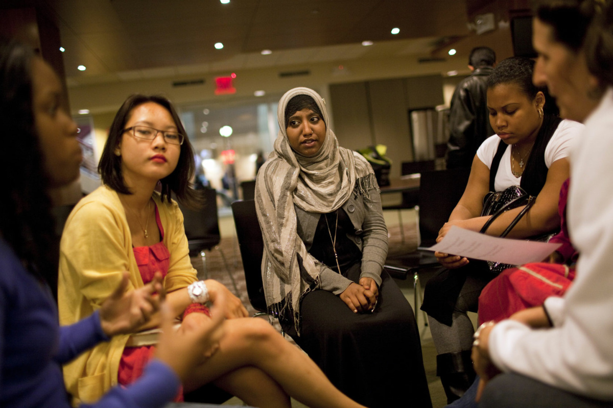 High school students in a semi-circle from New York City in conversation.