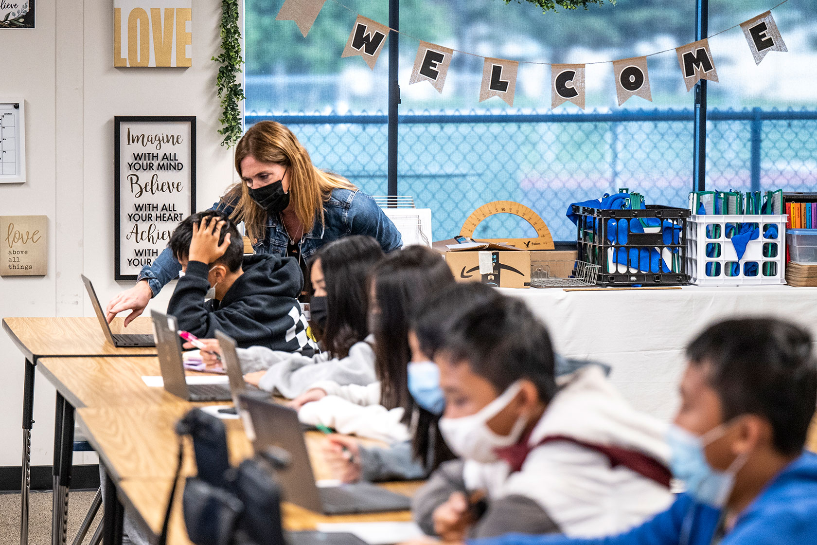 A curriculum specialist teaches a seventh-grade math class at a middle school in Huntington Beach, California,