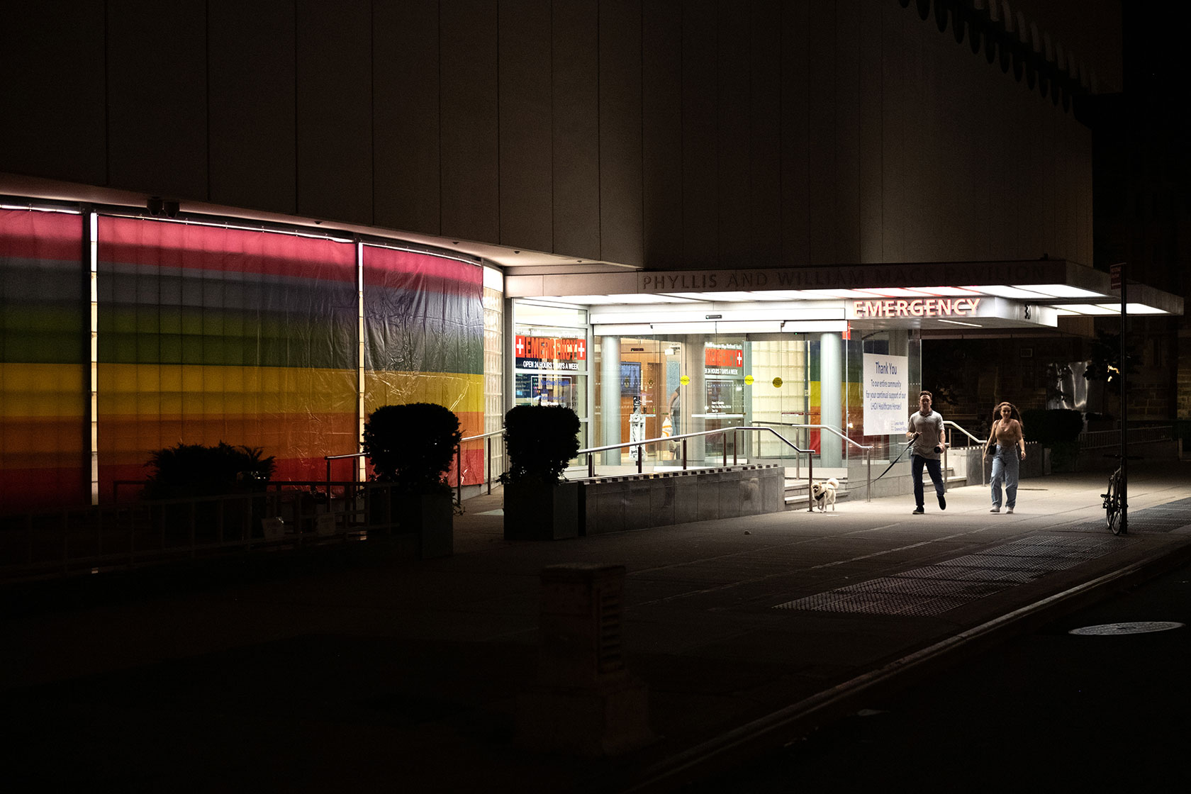People walk past a New York City hospital.
